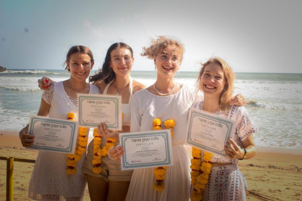 Students feeling happy after receiving yoga teacher course certification